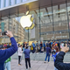 Customers queue to get their reserved iPhone 12 mobile phones at an Apple store in Shanghai on Oct. 23, 2020.